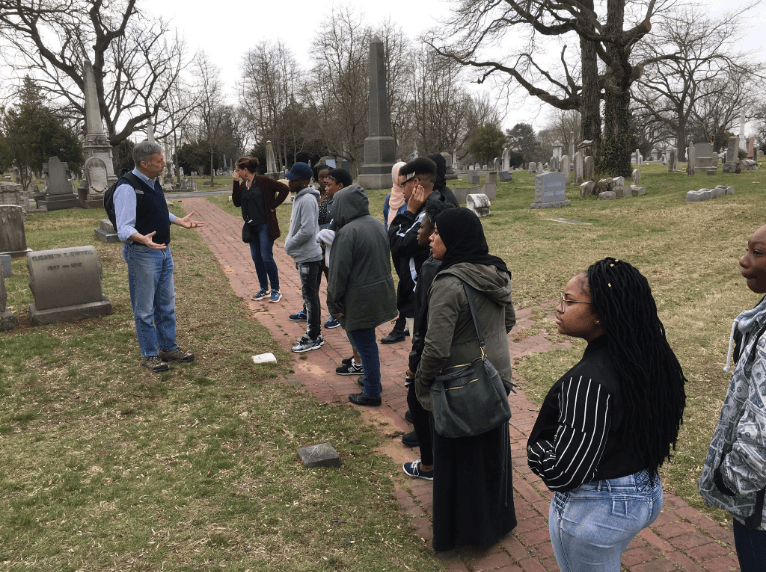 Jim Mundy delivers a tour for youth from the Karabots Junior Fellows Program at the Woodlands Cemetery