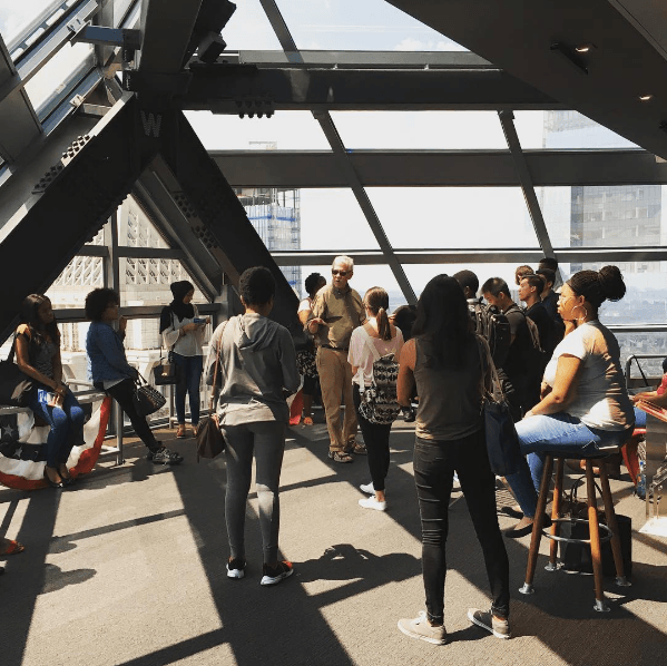 Students in the Teva Pharmaceuticals Internship Program hear a lecture from Penn Urban Studies professor Michael Nairn at the Liberty Place Observation Deck