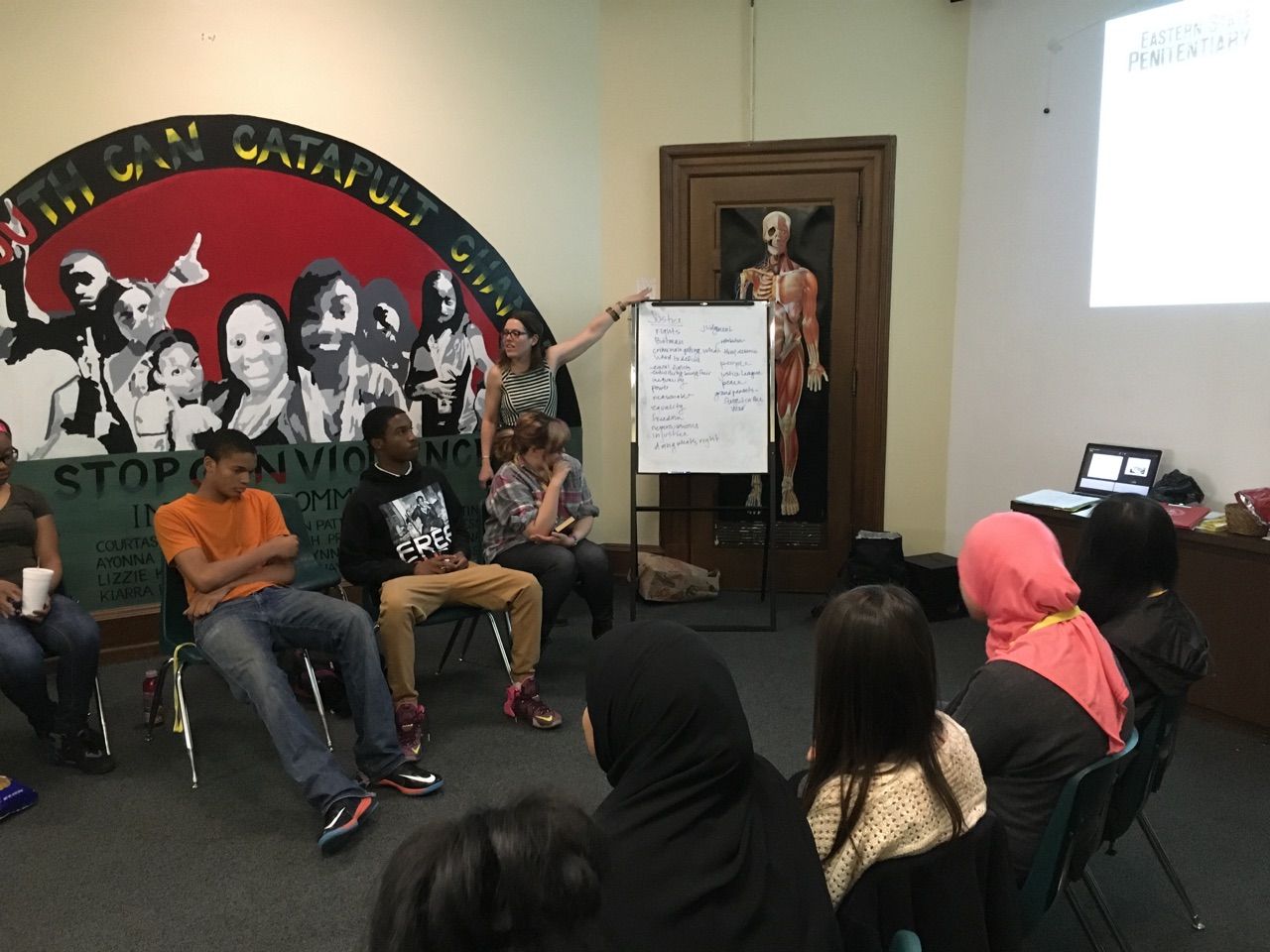 Lauren Zalut, Director of Education at Eastern State Penitentiary, works with the Karabots Junior Fellows to find a definition of "justice"
