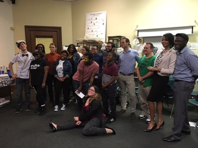 Participants of the "boos and Brains" event hosted by the Out4STEM Program pose with homemade masks