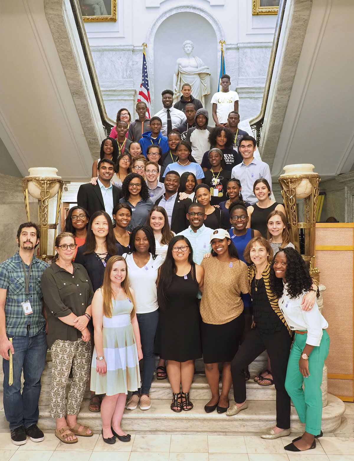 Students in the Karabots Junior Fellows and Penn SUMR Scholars Programs pose on the marble staircase at the College of Physicians of Philadelphia