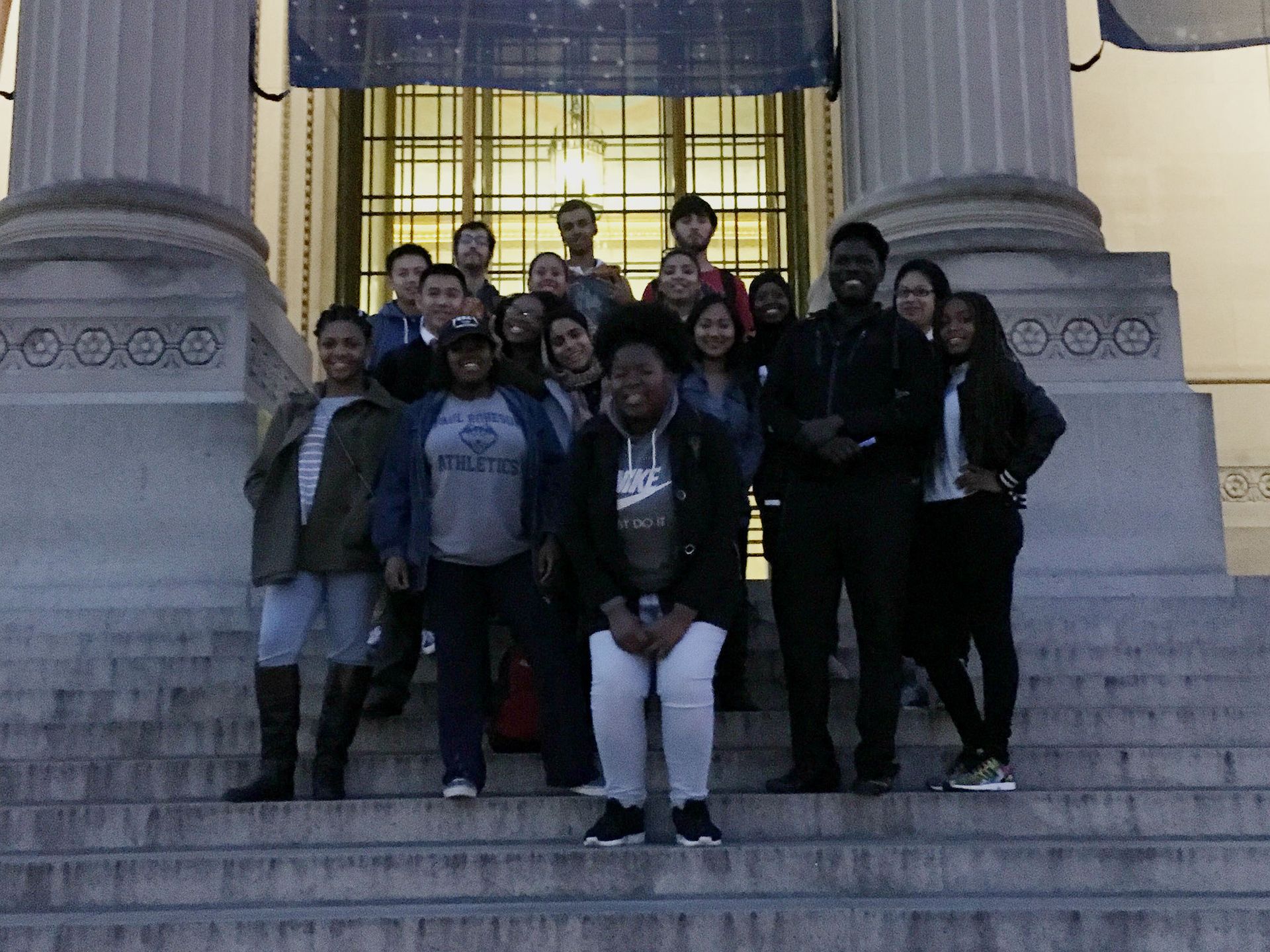 Students in the Teva Pharmaceuticals Internship Program pose on the marble steps in front of the Franklin Institute
