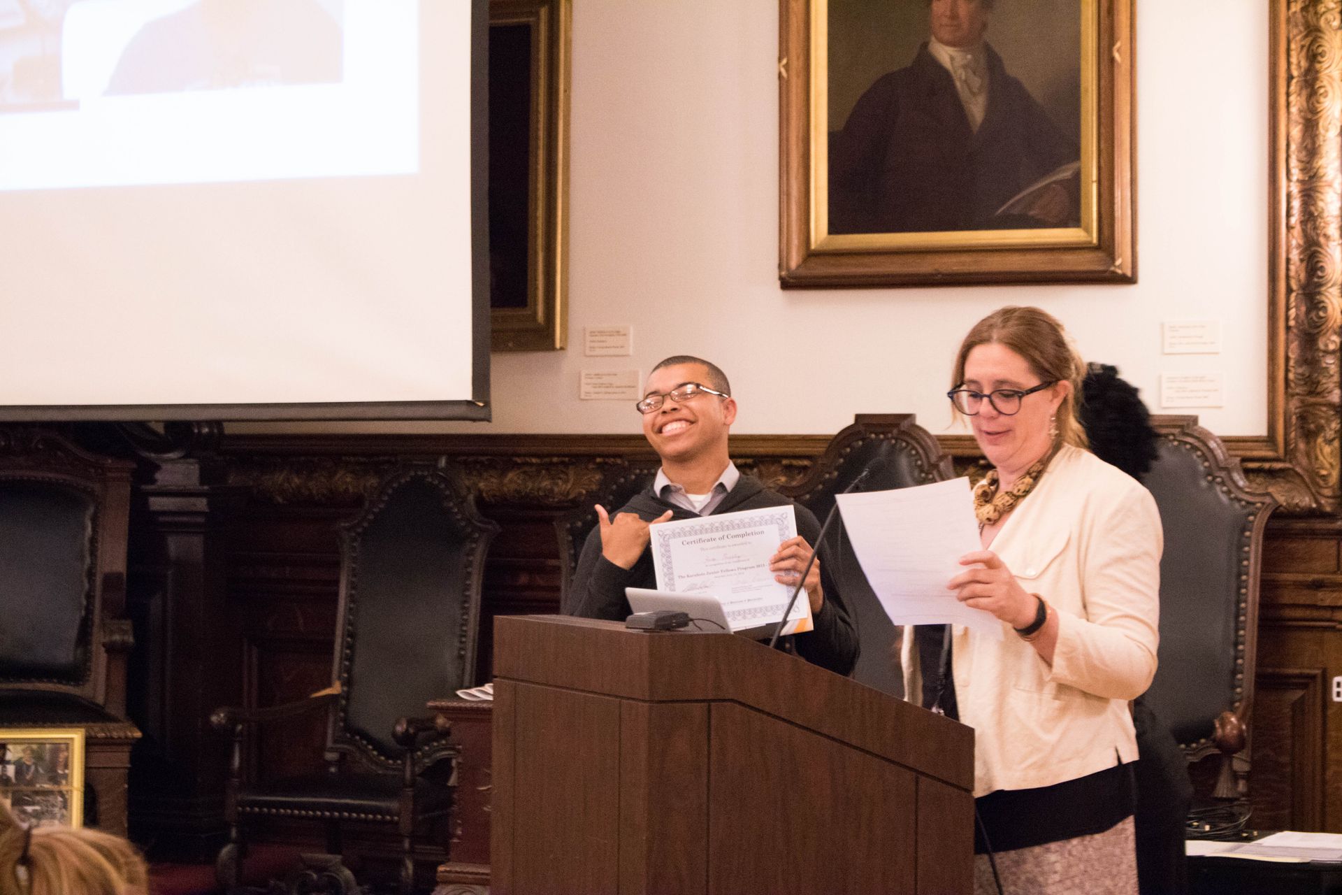 Kevin, one of the graduating Karabots Junior Fellows, receives his certificate of completion from CEPI Director Jacqui Bowman 