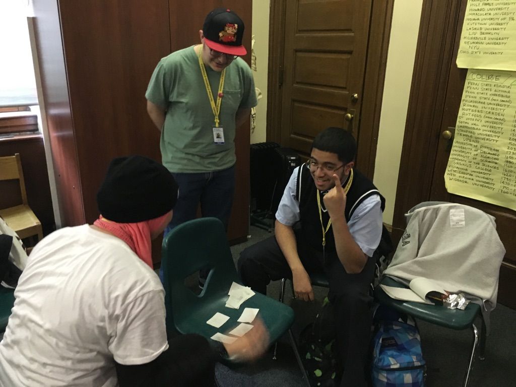 Students in the Karabots Junior Fellows Program discuss their forensics-themed game