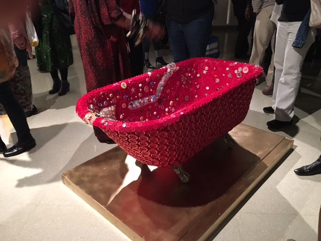 A piece depicting a bathtub covered in buttons in the African American Museum in Philadelphia exhibit I Found God in Myself