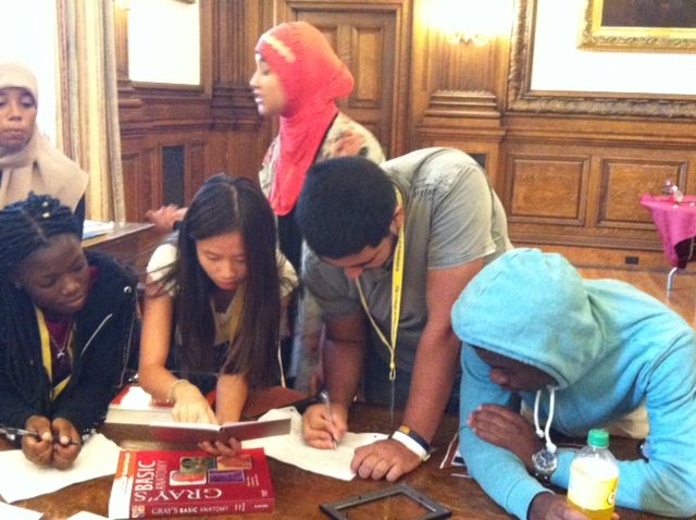 Karabots Fellows solving puzzles in the Room Escape Game "Dr. Mutter's Secret Specimen"