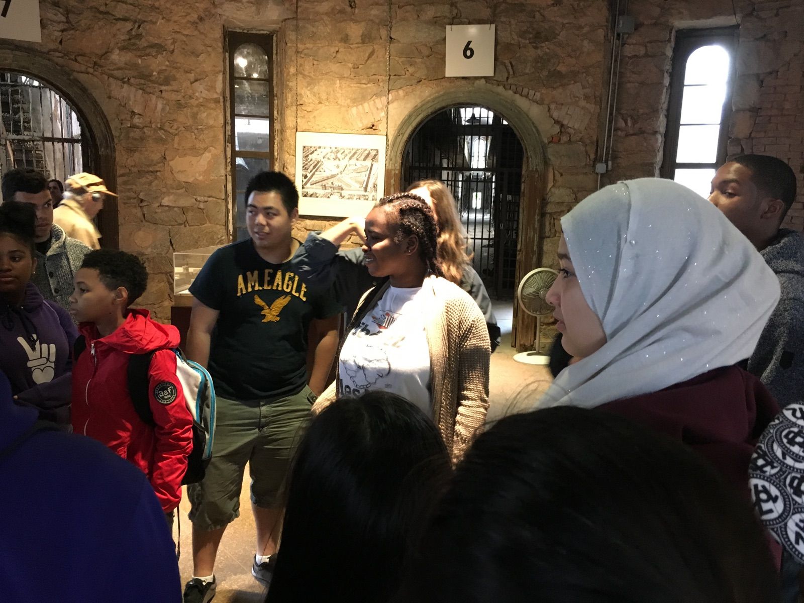 Teva and Karabots Fellows interact with tour guide Lauren Bennett at Eastern State Penitentiary