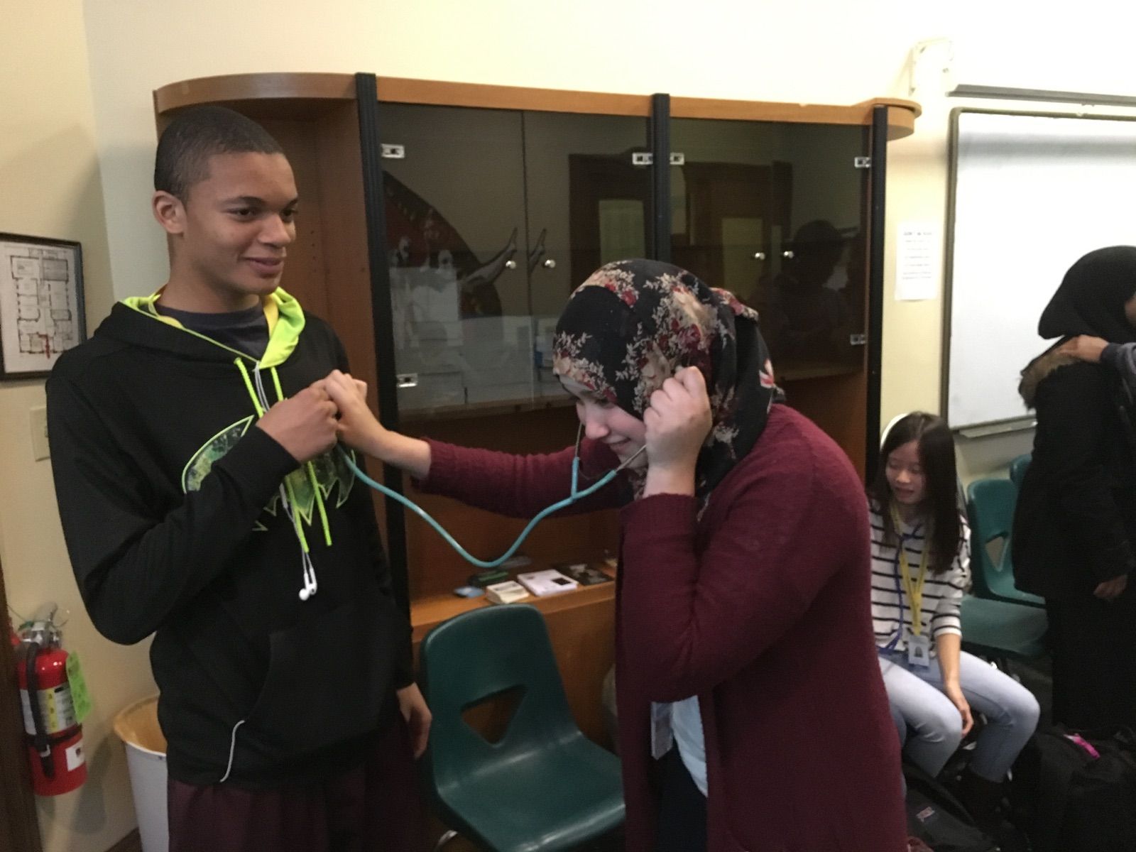 Karabots Junior Fellows experiment with giving each other auscultations