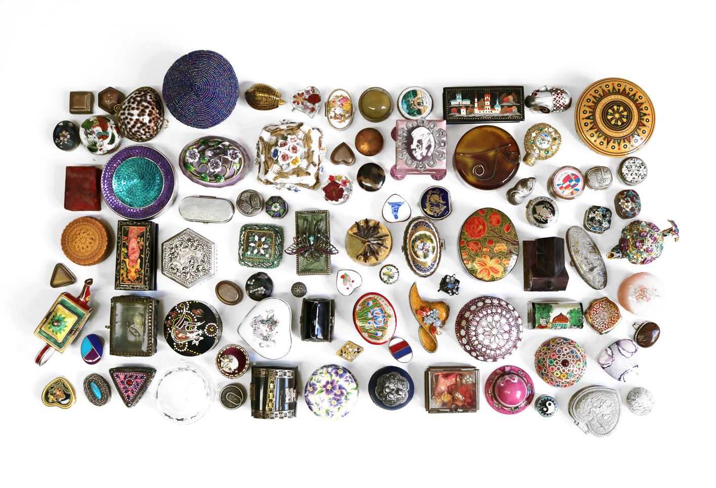 Collection of pillboxes of different shapes, sizes, and colors