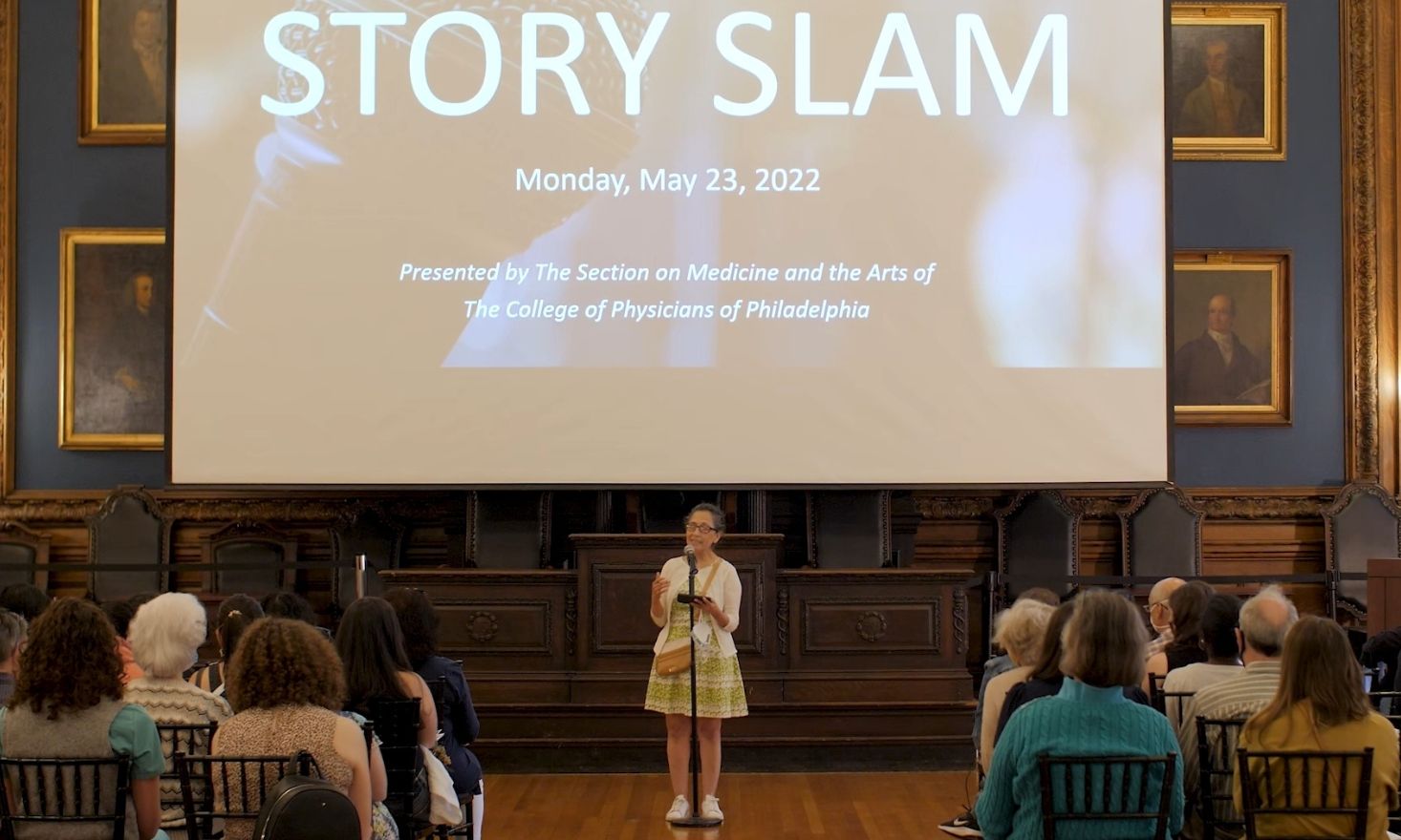 photo of contestant telling story at 5th annual story slam event