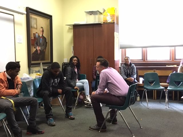 Jon Goff, Associate Director of Fellow Ship Relations for the College of Physicians of Philadelphia, conducts a mock job interview with Quran, a student in the Karabots Junior Fellows Program. The two are seated opposite each other (Goff in the center, an