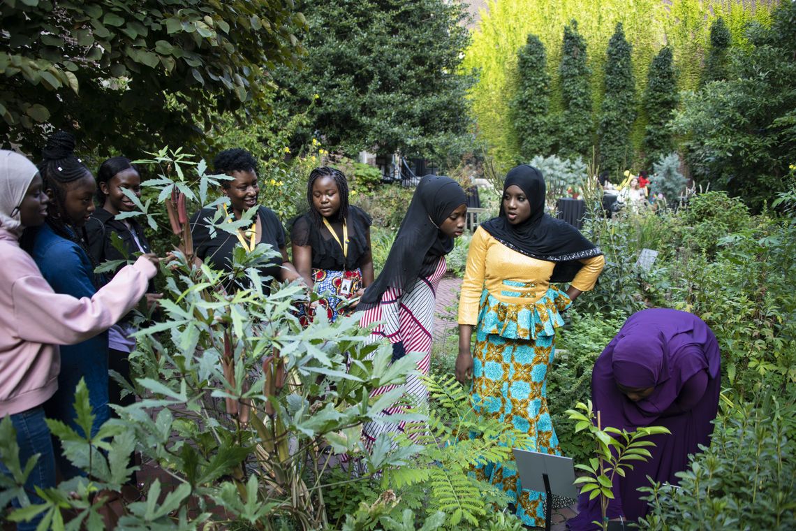 Students in the Girls One Diaspora Club walk through the Benjamin Rush Medicinal Herb Garden
