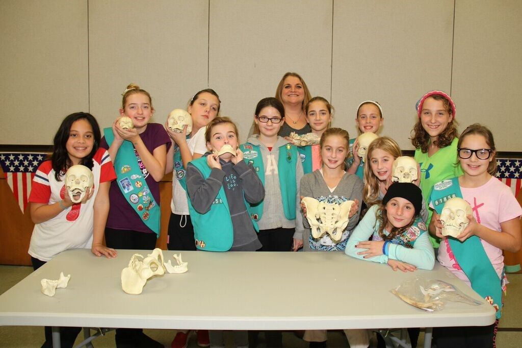 A Troop of Girl Scouts learn about forensic anthropology during our "Bone Detectives" activity