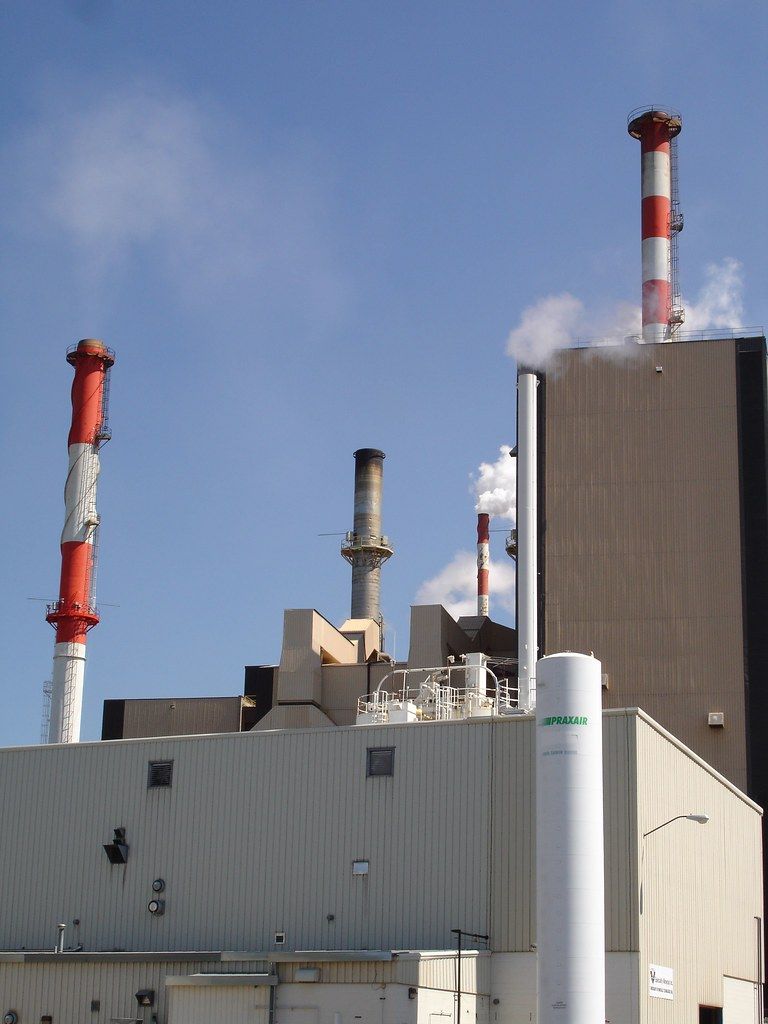 Factory emitting exhaust into the sky