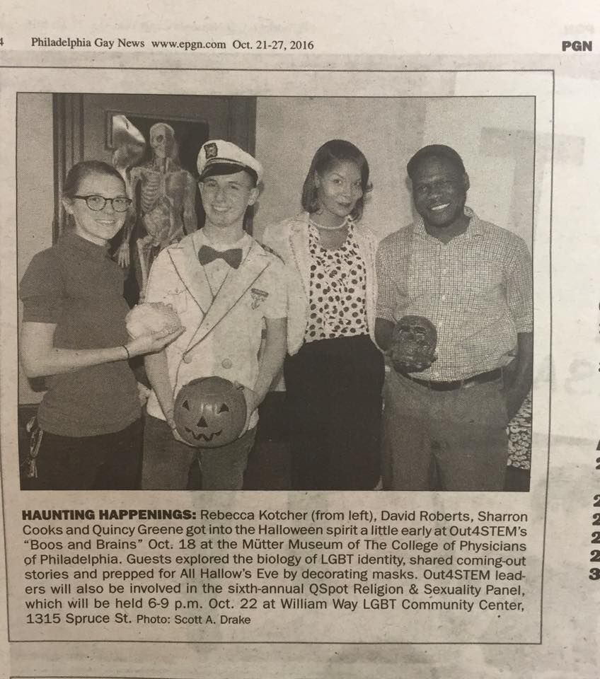 Clipping from Philadelphia Gay News displaying four participants holding skulls and jack-o-lanterns at the Out4STEM event Boos and Brains. 